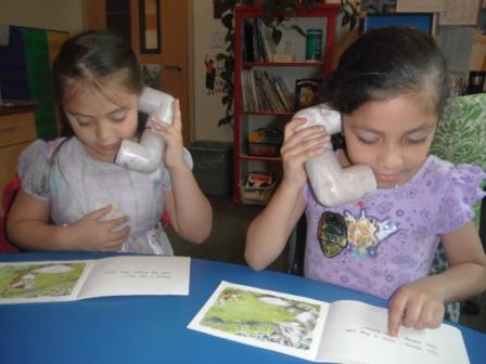 Students using phones made of PV to listen to selfs read Students using phones made of PV to listen to selfs read