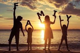Happy family enjoying a sunset