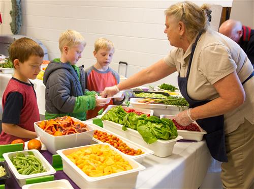 Students trying new vegetables  