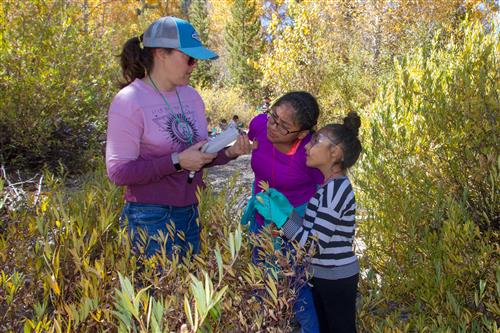 Teacher with students at ROES camp 