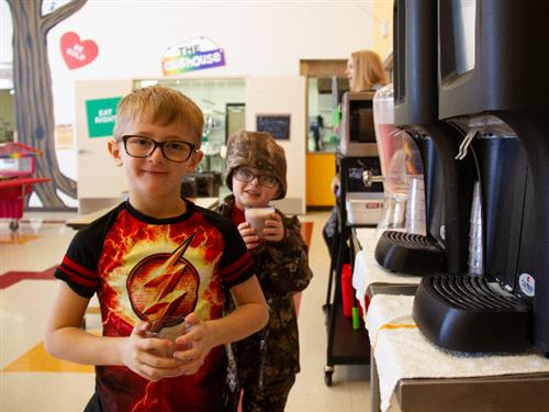 students with milk dispenser 