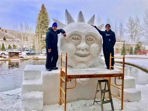 Student with ice sculpture 