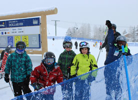 students with a teacher in ski gear at dollar mountain