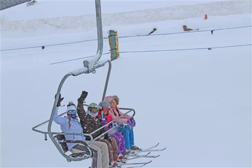 students on ski lift 